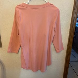 Peach colored long sleeve top